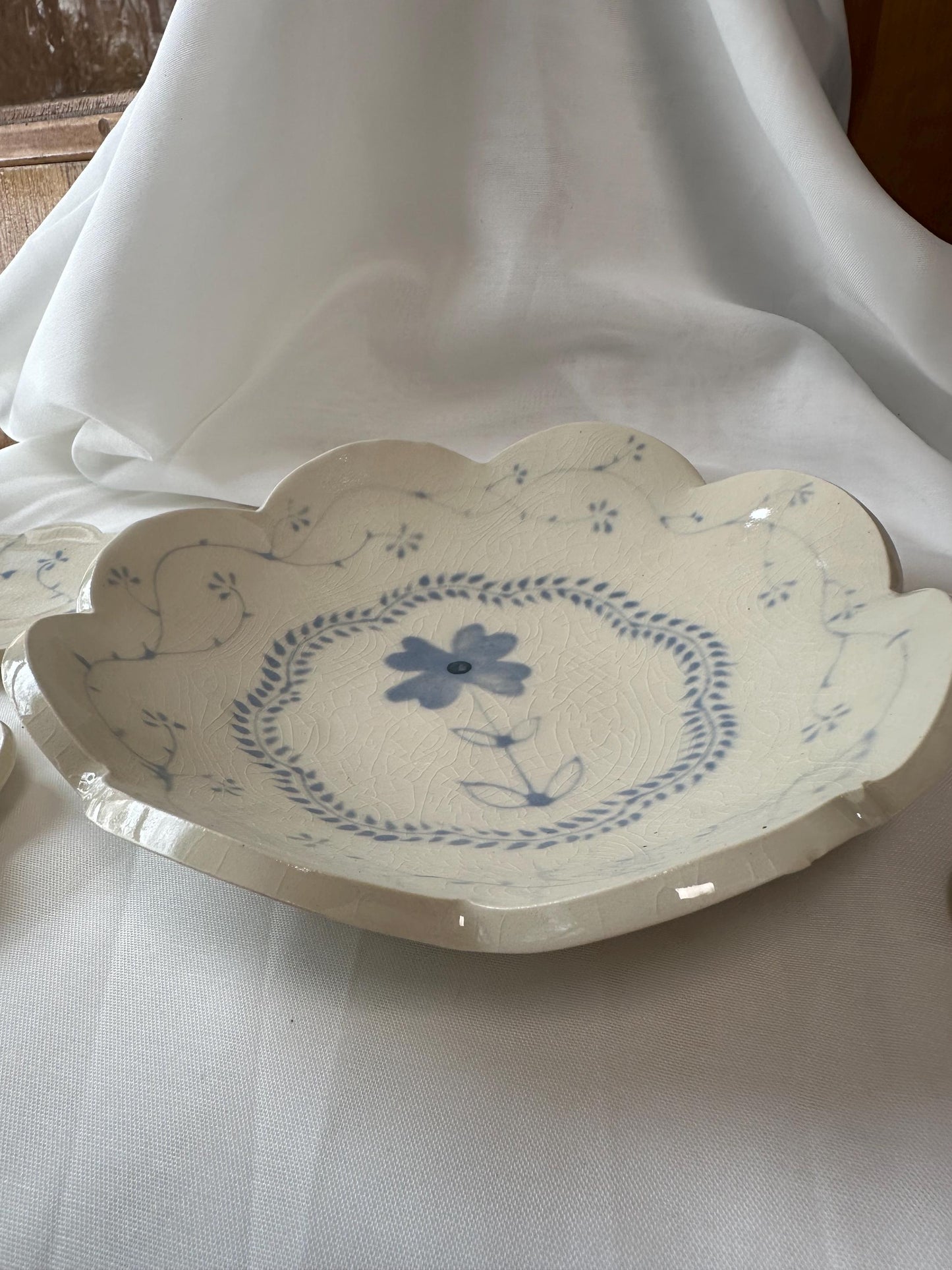 Handmade and hand painted pottery bowl, with handpainted blue underglaze and finished in a clear glaze, 8”