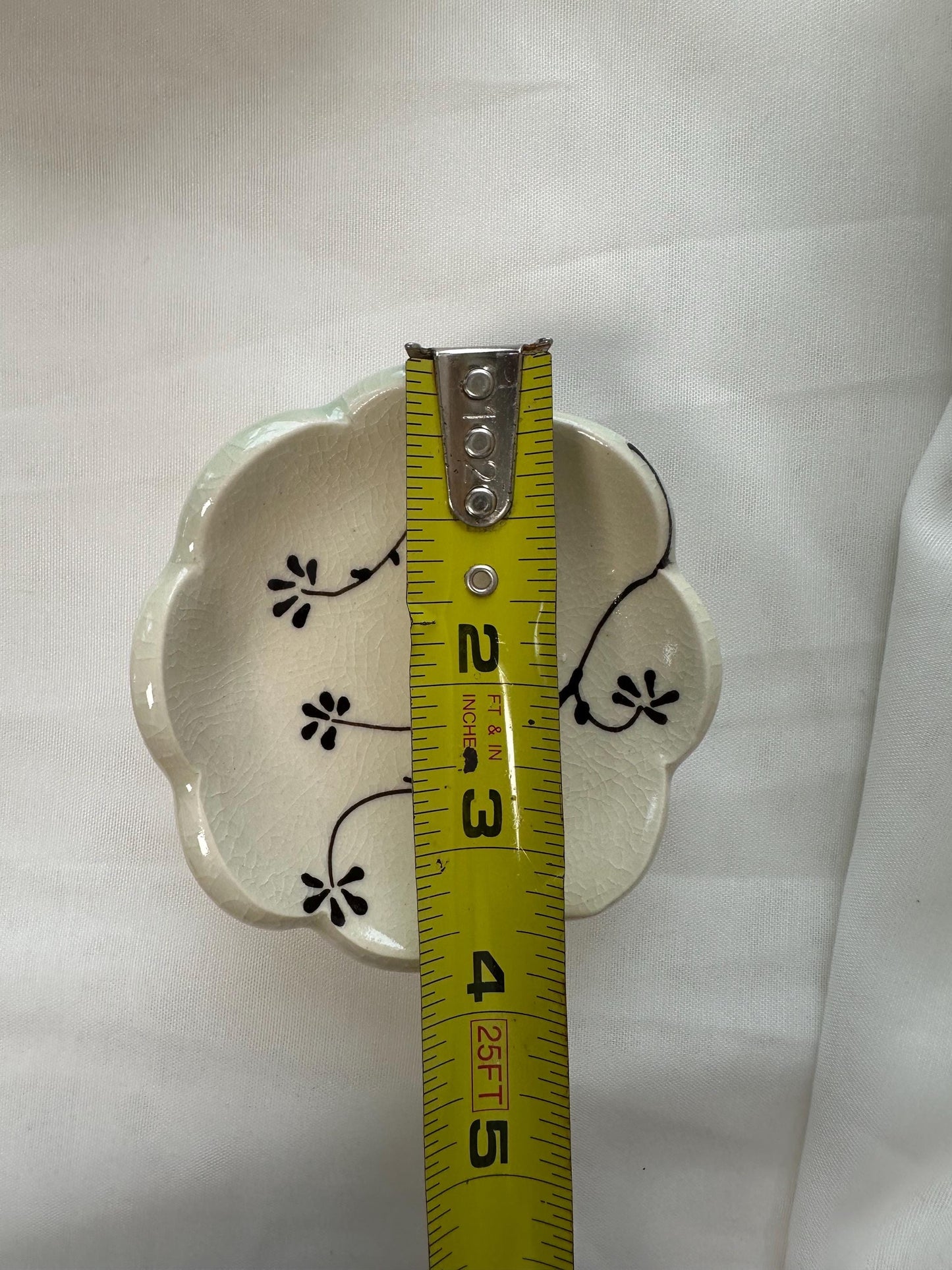 Handmade and hand painted pottery trinket dish, with handpainted brown underglaze and finished in a clear glaze, 3”