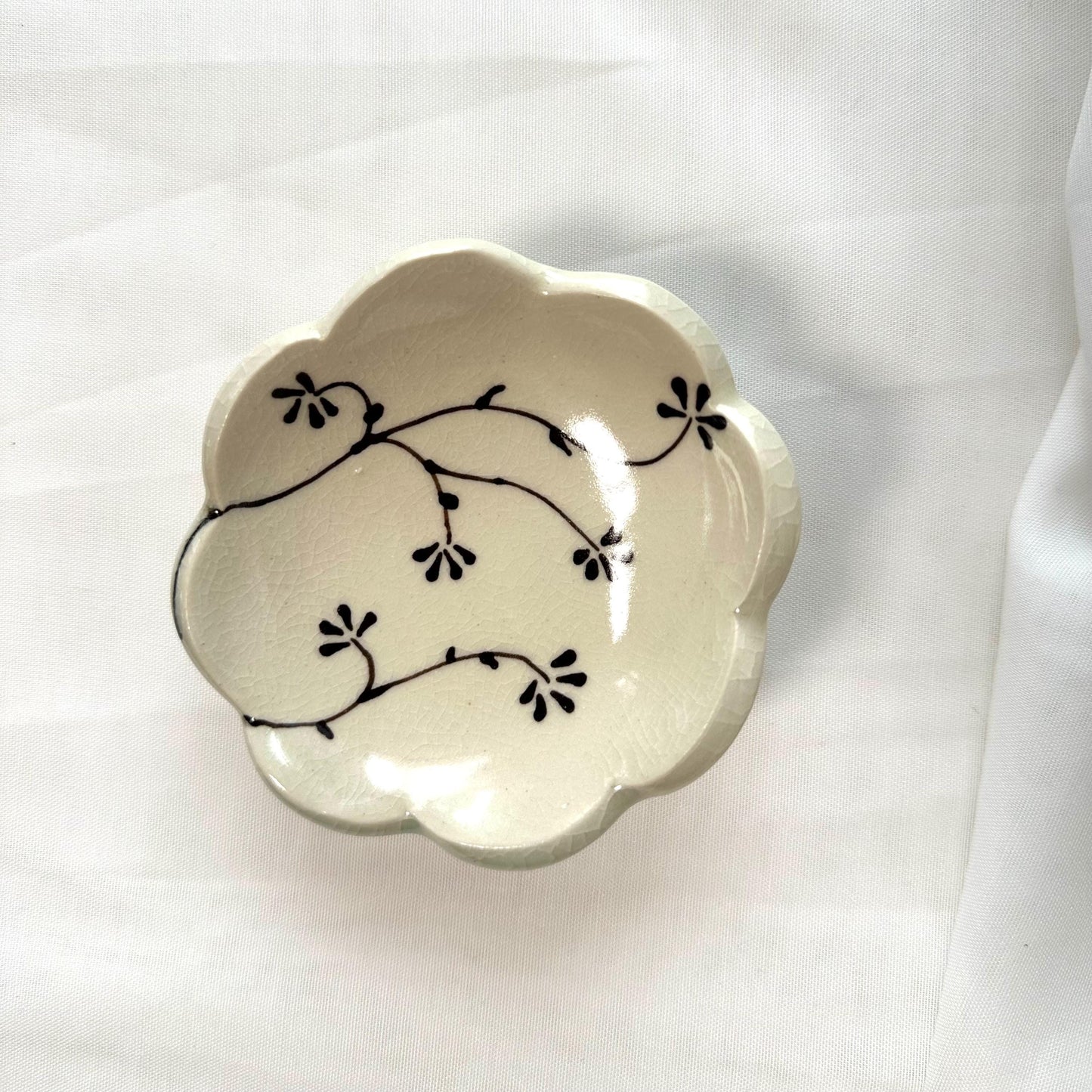 Handmade and hand painted pottery trinket dish, with handpainted brown underglaze and finished in a clear glaze, 3”