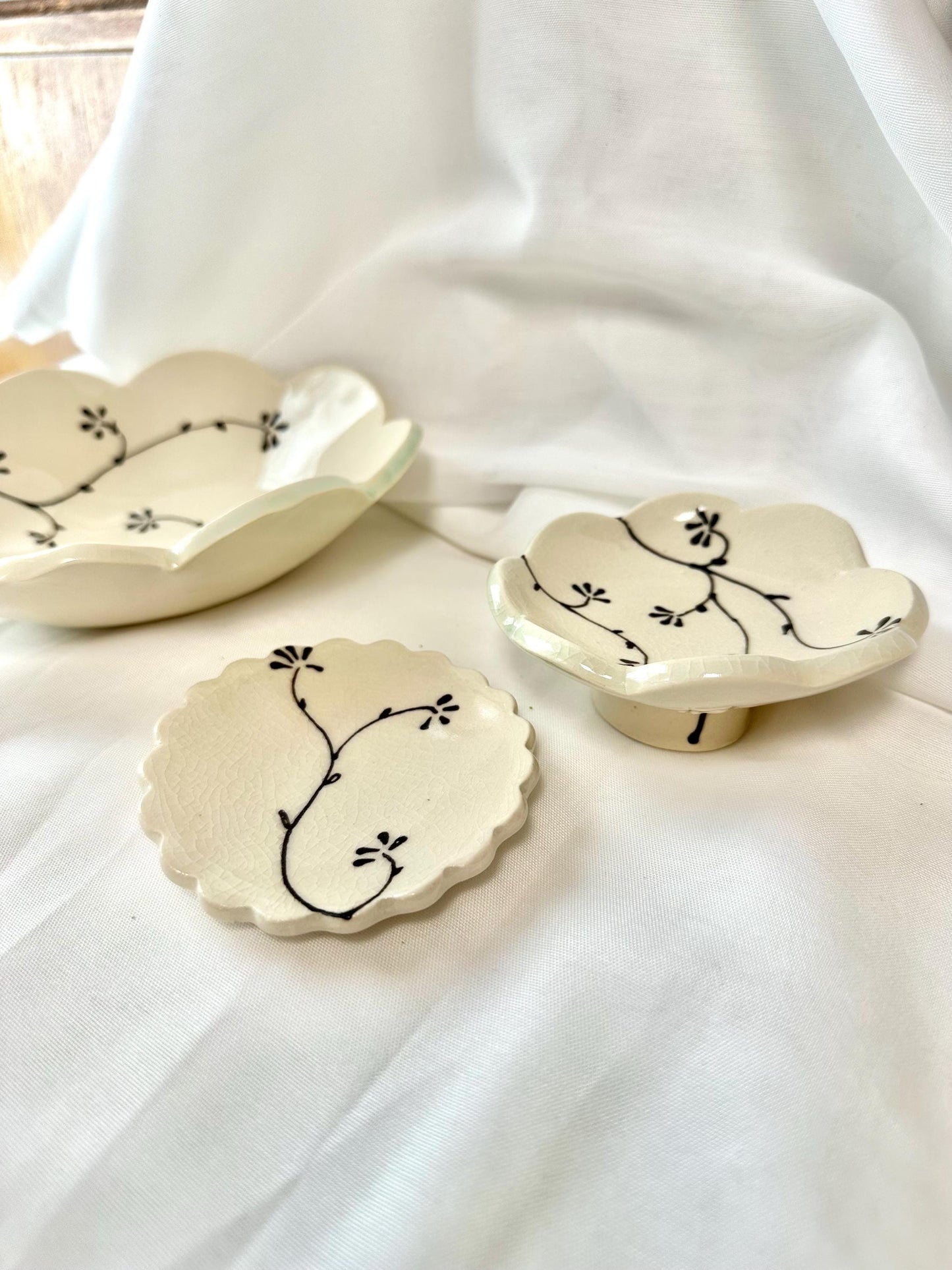 Handmade and hand painted pottery trinket dish, with handpainted brown underglaze and finished in a clear glaze, 3”