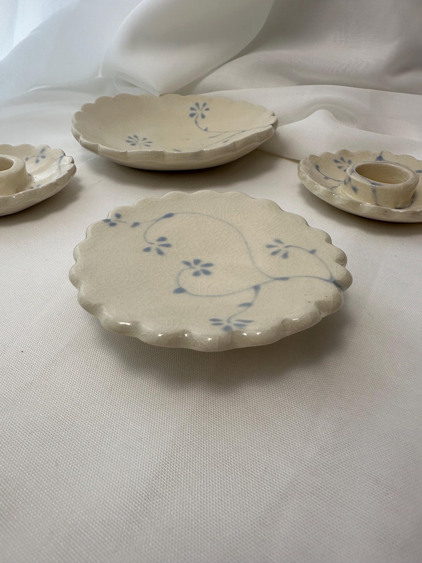 Handmade and hand painted pottery trinket dish, with handpainted blue underglaze and finished in a clear glaze, 3” with foot