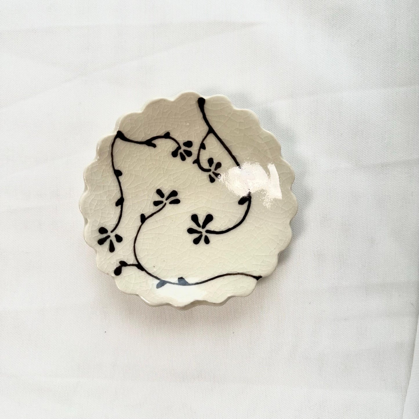 Handmade and hand painted pottery trinket dish, with handpainted brown underglaze and finished in a clear glaze, 3”