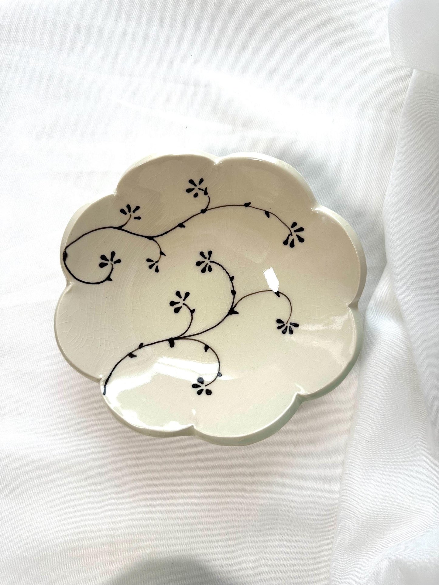 Handmade and hand painted pottery bowl, with handpainted green underglaze and finished in a clear glaze, 7”