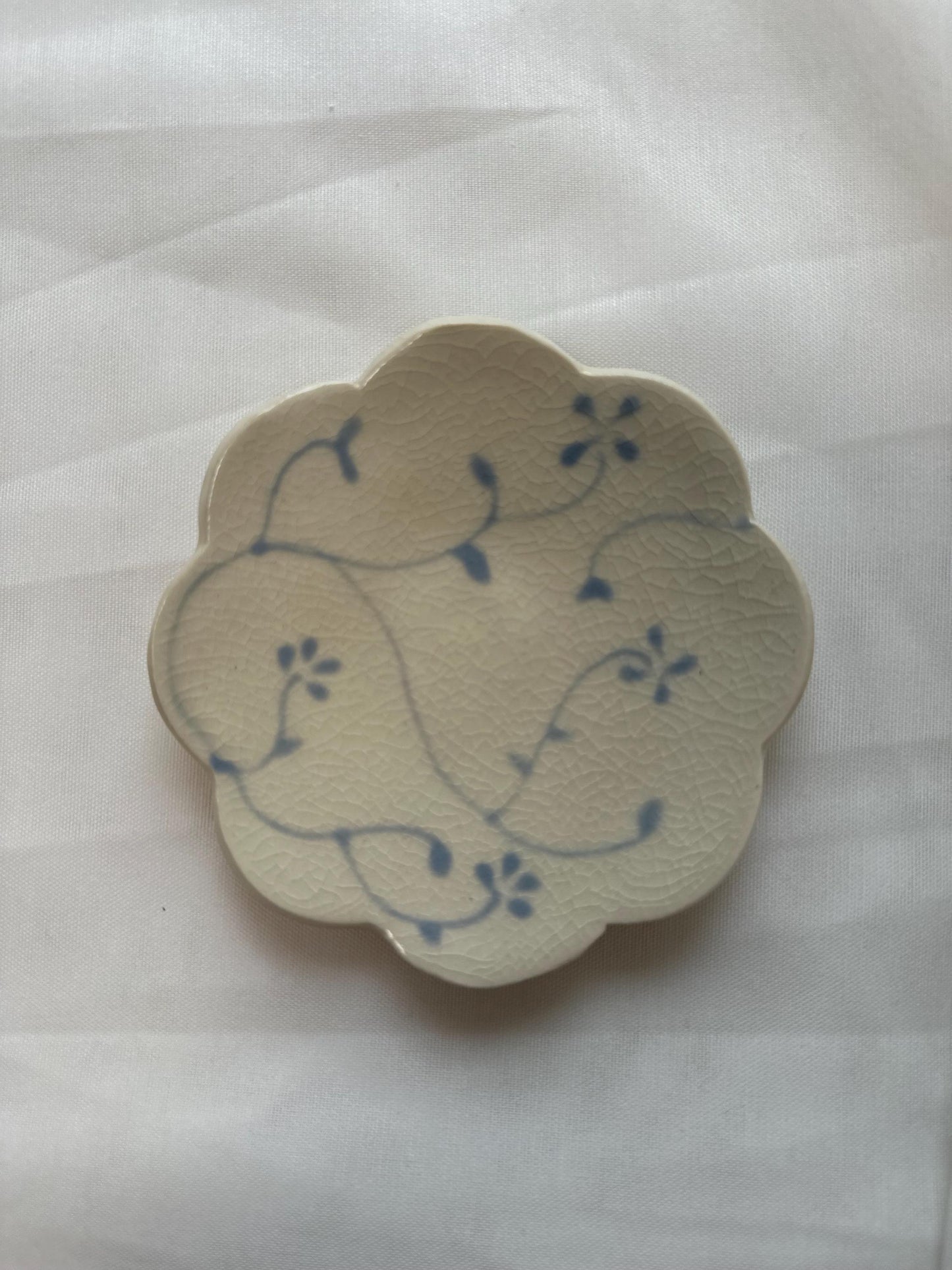 Handmade and hand painted pottery bowl, with handpainted blue underglaze and finished in a clear glaze, 4”