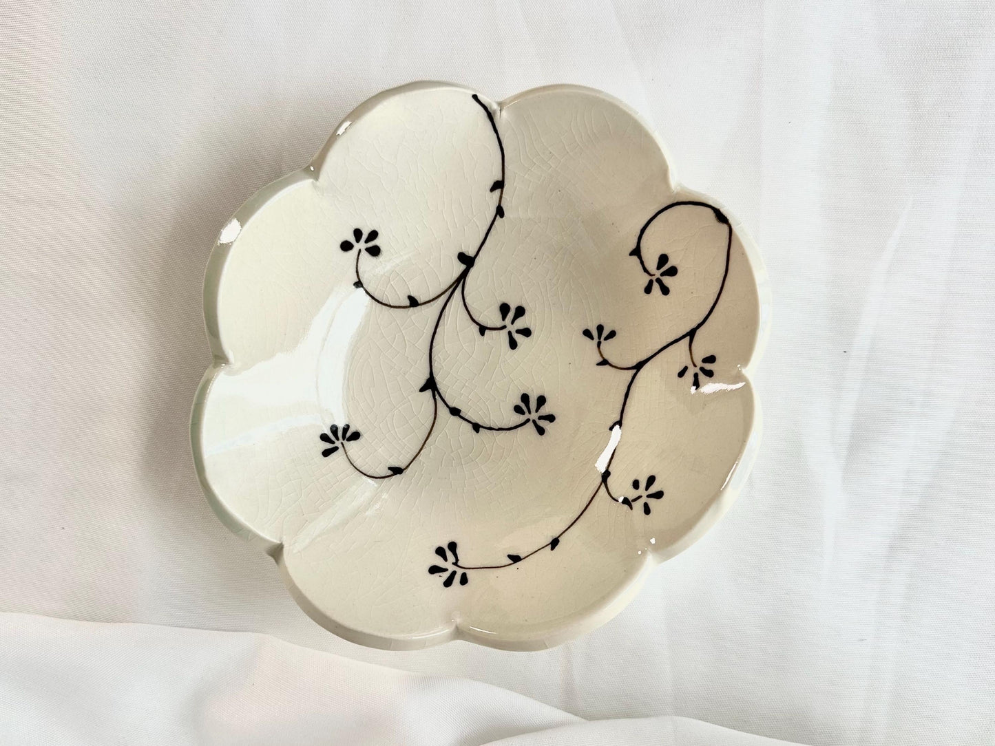 Handmade and hand painted pottery bowl, with handpainted green underglaze and finished in a clear glaze, 7”