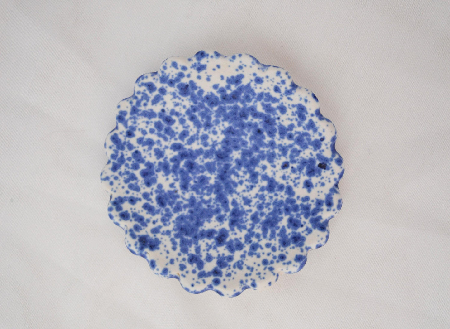 Handmade trinket dish with scalloped edges and vibrant blue splatterware glaze, Matte Finish, 3 Inches Diameter