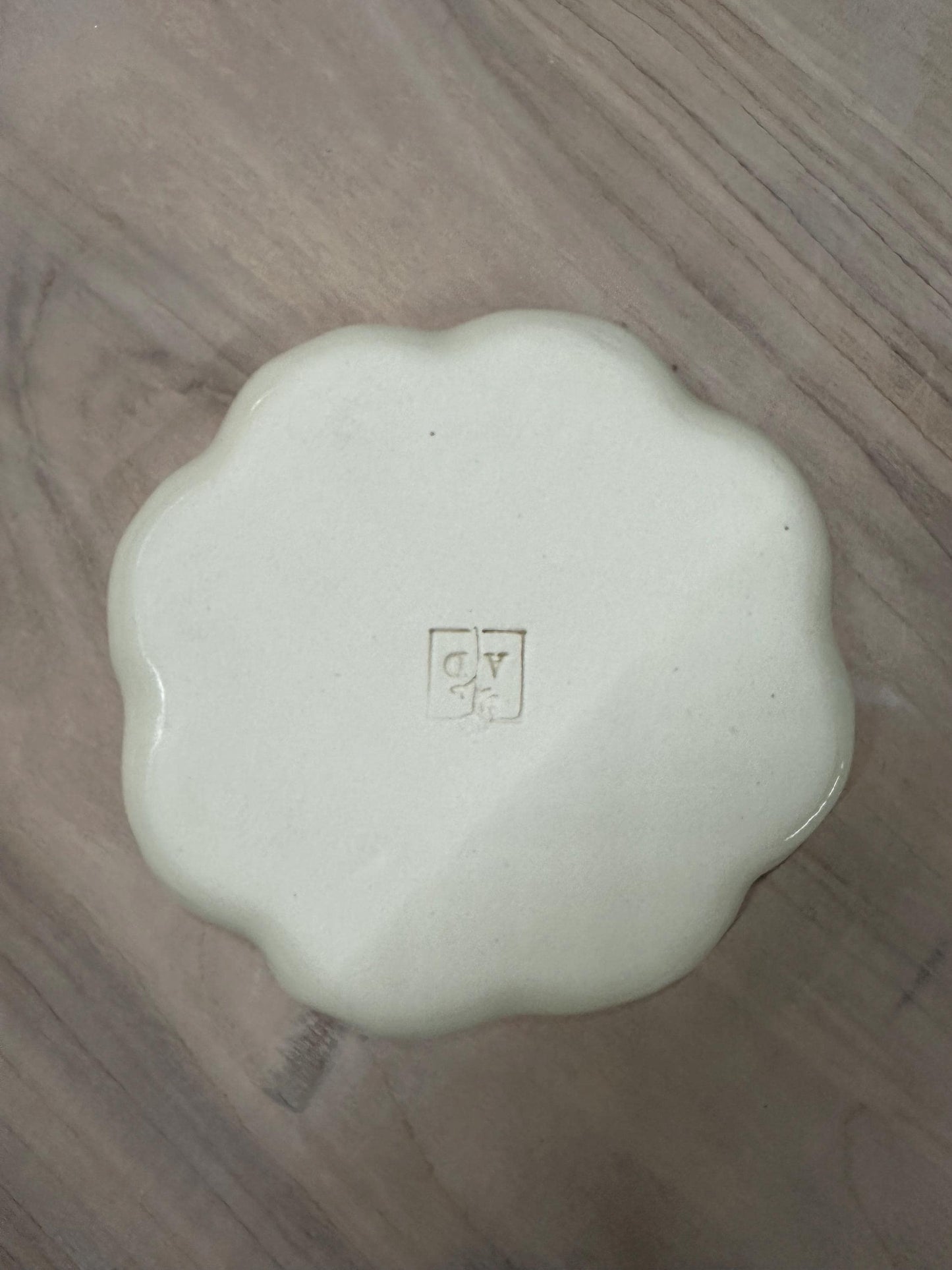 Handmade and hand painted pottery plate, scalloped edges, floral design hand painted in a sage green, finished with a clear crackle glaze