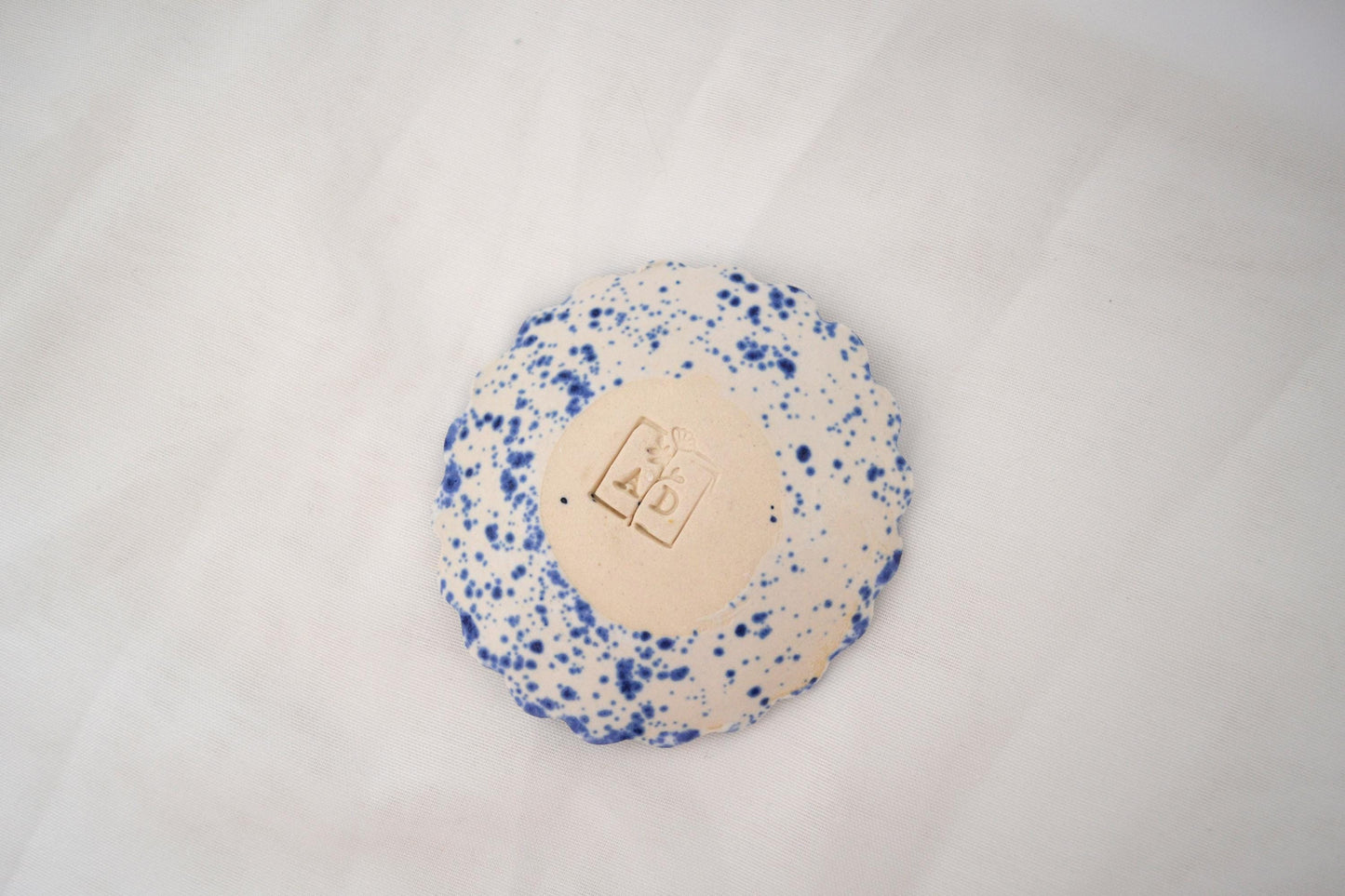 Handmade trinket dish with scalloped edges and vibrant blue splatterware glaze, Matte Finish, 3 Inches Diameter