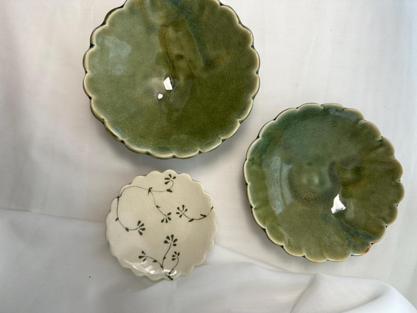 Handmade and hand painted pottery trinket dish,  with handpainted green underglaze and finished in a clear glaze, 3” with foot