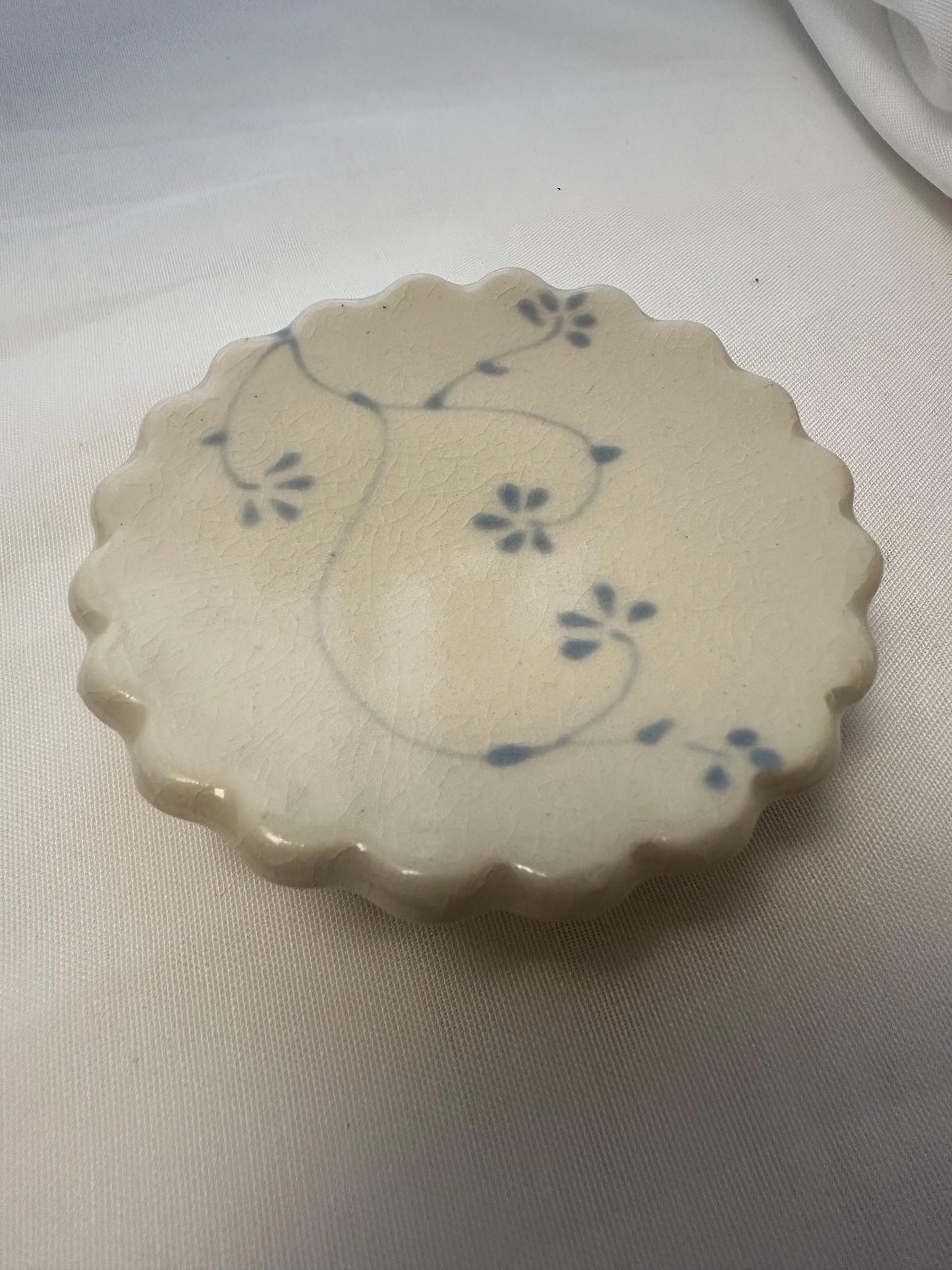 Handmade and hand painted pottery trinket dish, with handpainted blue underglaze and finished in a clear glaze, 3” with foot