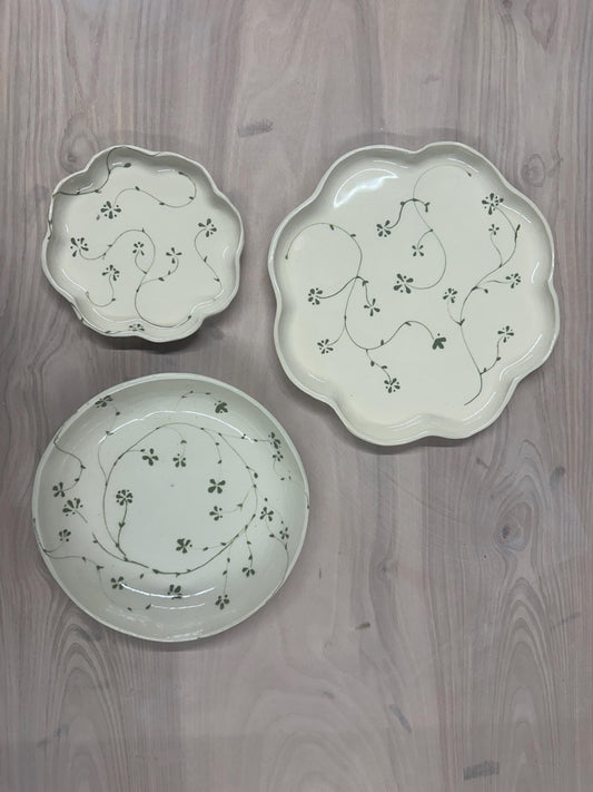 Handmade and hand painted pottery plate, scalloped edges, floral design hand painted in a sage green, finished with a clear crackle glaze