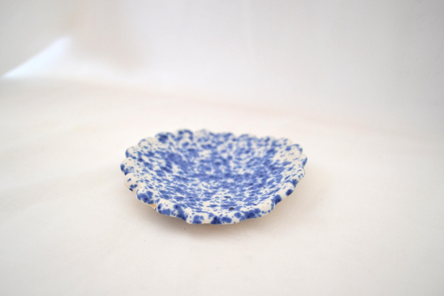 Handmade trinket dish with scalloped edges and vibrant blue splatterware glaze, Matte Finish, 3 Inches Diameter