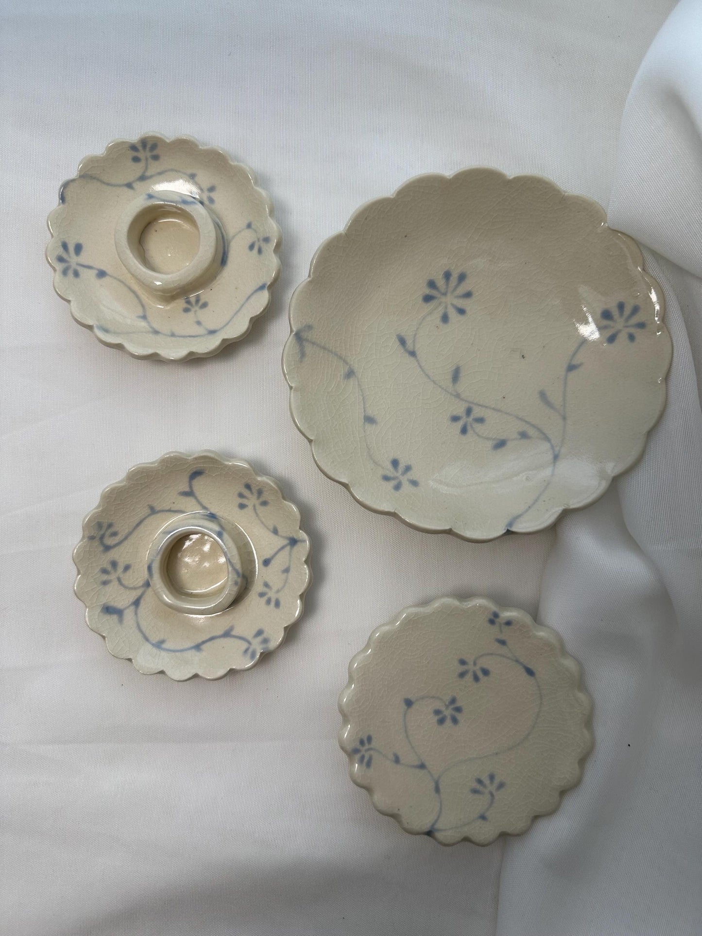 Handmade and hand painted pottery trinket dish, with handpainted blue underglaze and finished in a clear glaze, 3” with foot
